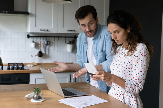 Man and women in recovery in Kitchen discussing letter