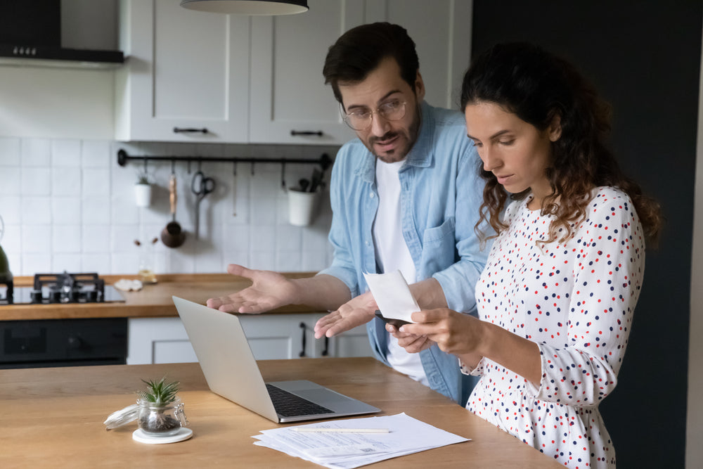 Man and women in recovery in Kitchen discussing letter