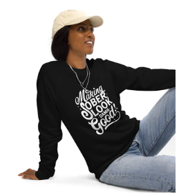 woman wearing black longsleeve tshirt that says making sober look good again